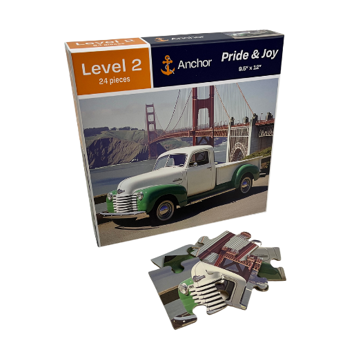 Puzzle packaging with a vintage truck and Golden Gate Bridge, featuring Anchor Pride & Joy branding.