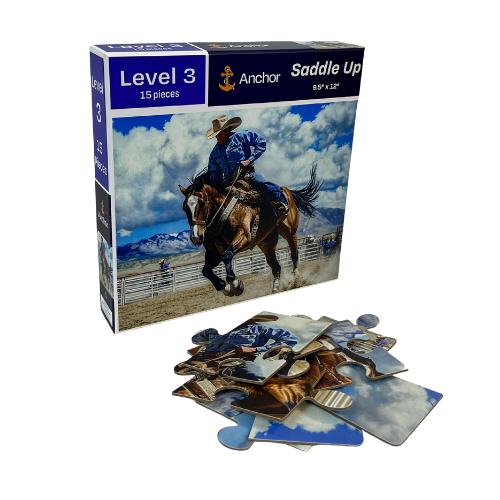 Jigsaw puzzle packaging with a cowboy on a horse and scattered pieces on a white background